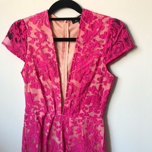 Hot pink romper with plunging neckline